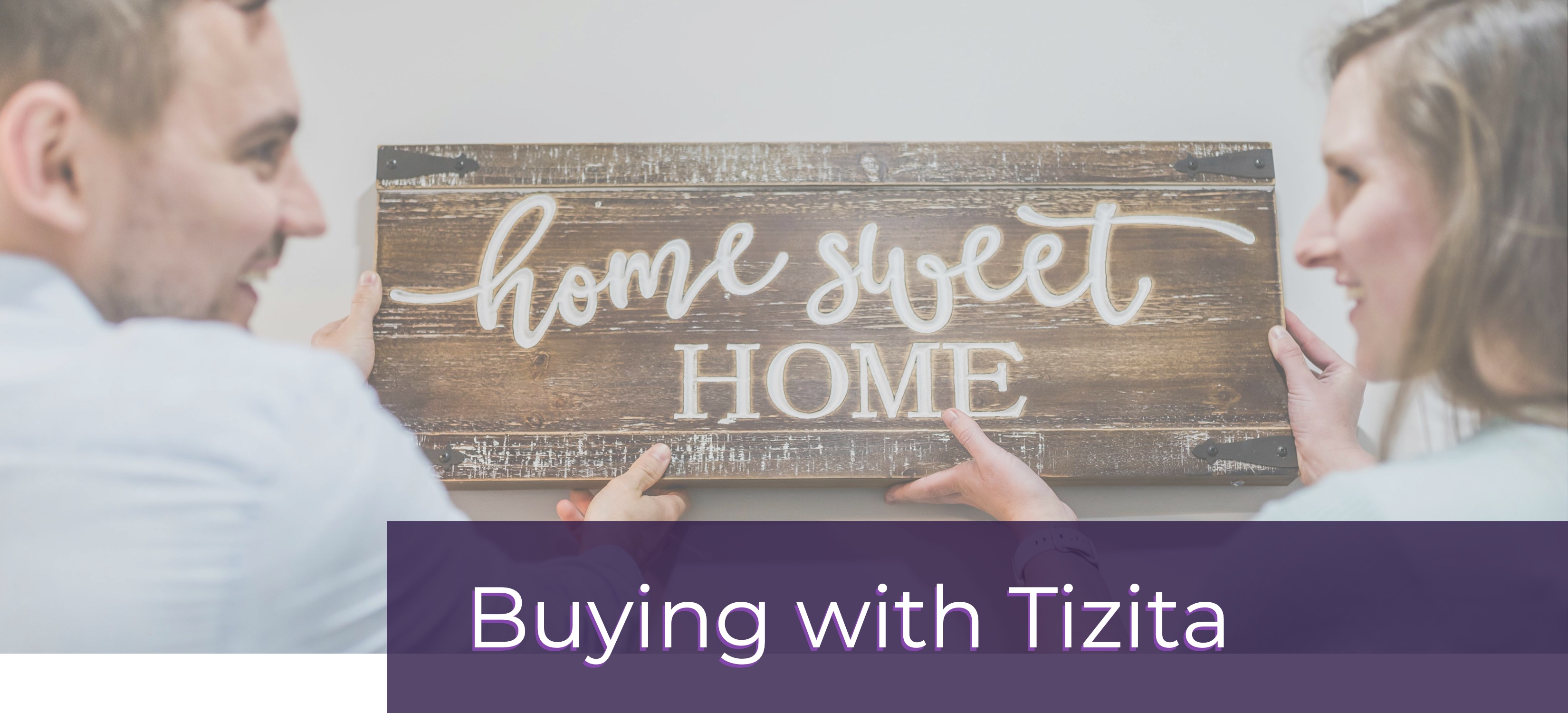 happy couple hanging Home Sweet Home sign with text Buying with Tizita